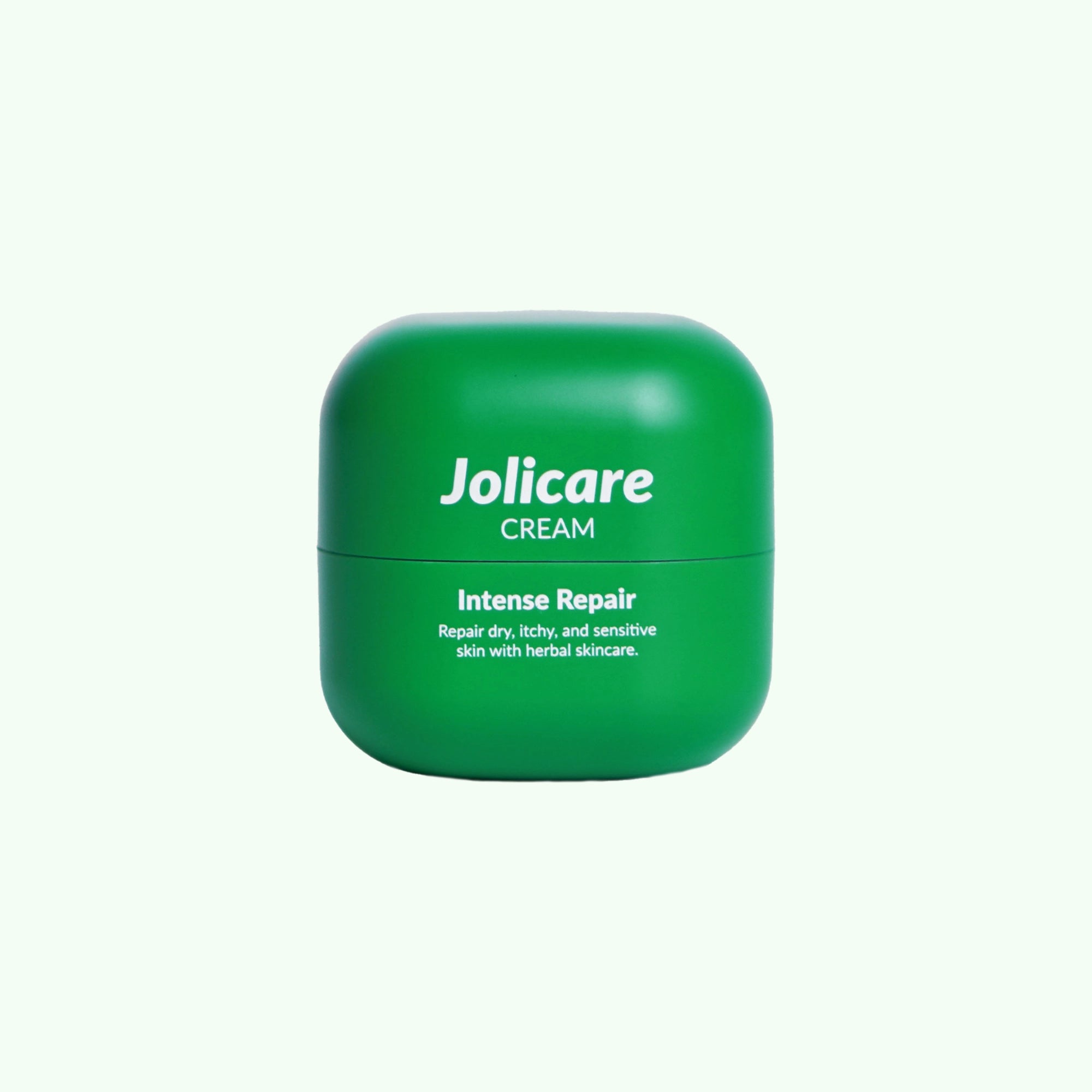 Green jar of Jolicare Cream 15g on a light background